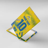 Yellow canvas wall art with custom text and blue number 10, angled view