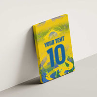 Yellow canvas wall art with custom text and blue number 10, side angle