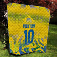 Yellow quilt blanket with blue number 10, "Your Text" text, and quilted stitching