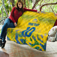Yellow quilt with quilted pattern, blue number 10 and "Your Text" shown outdoors