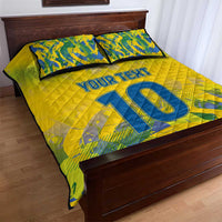 Yellow quilt bed set with blue '10' and 'YOUR TEXT', quilted look with matching pillows