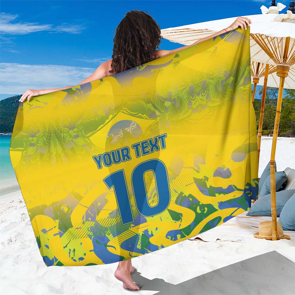 Yellow camo sarong with 'YOUR TEXT' and large blue '10' print.