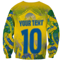 Yellow sweatshirt with back number 10 and blue outline text, Brazil pattern graphics