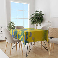 Yellow tablecloth with blue abstract football graphics on dining table