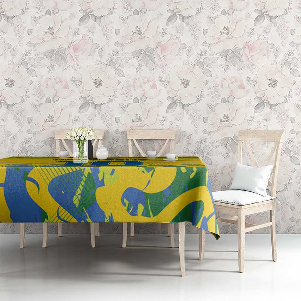 Yellow tablecloth with blue sports pattern on rectangular dining table