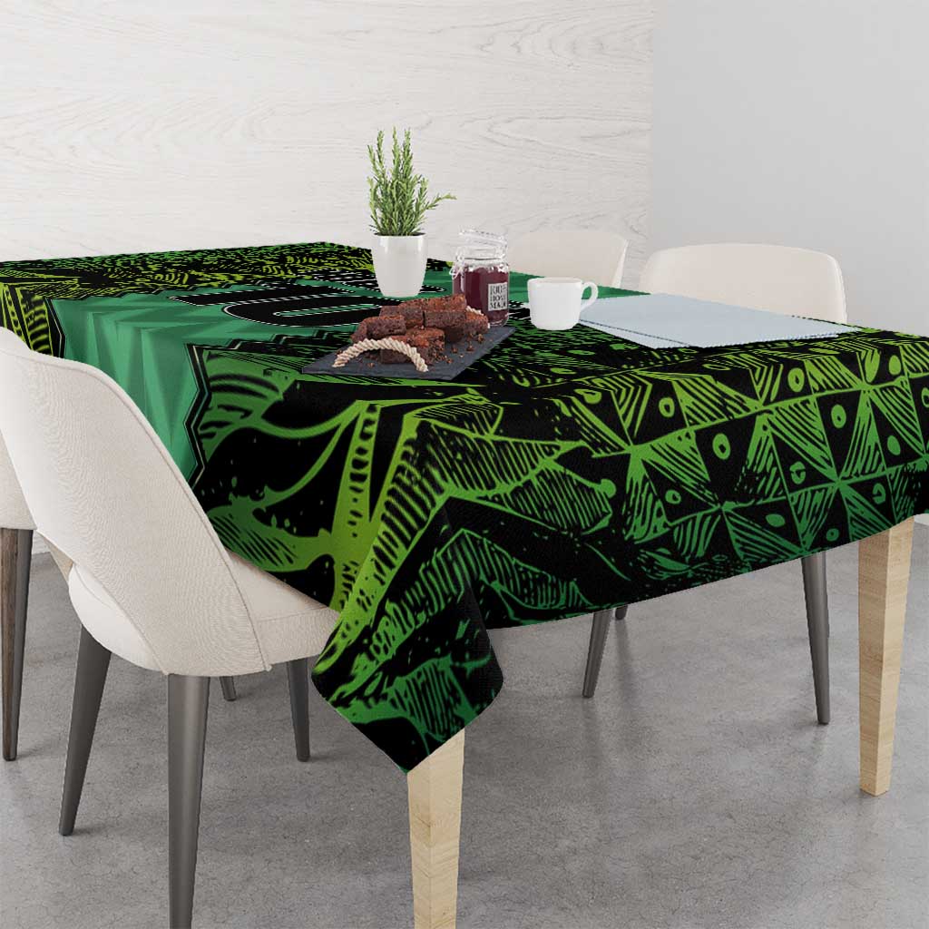Green football-themed tablecloth with geometric pattern covering dining table.