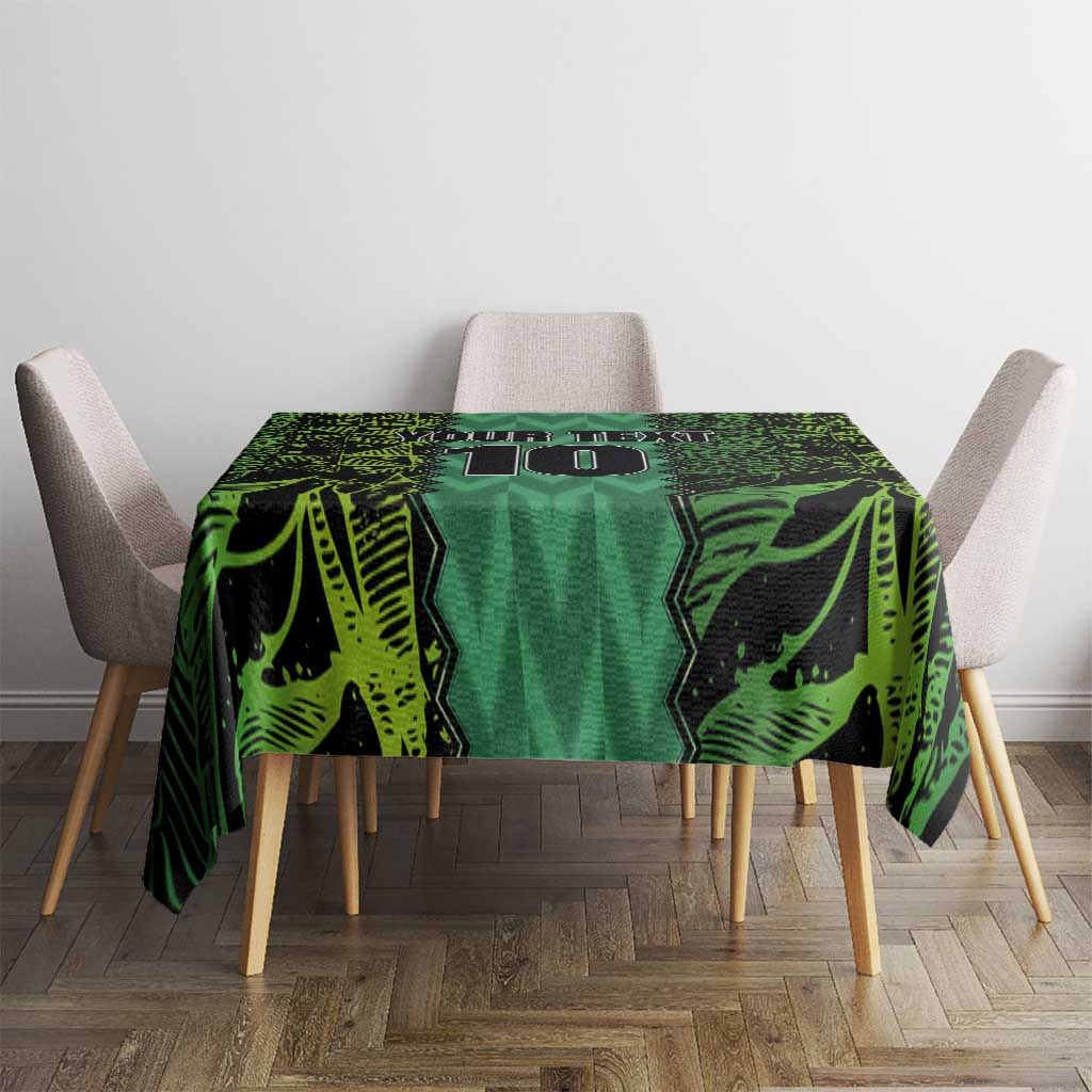 Green football-themed tablecloth with bold geometric pattern on tabletop.