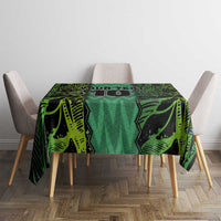 Green football-themed tablecloth with bold geometric pattern on tabletop.