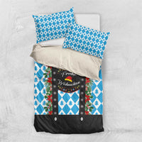 Folded Christmas bedding set with blue diamond and pine tree design and black center panel