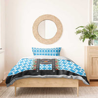 Christmas bedding set with blue diamond top, pine trees, and black wreath graphic panel