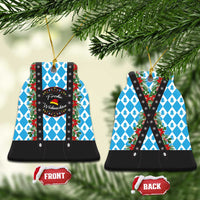 Two round ceramic Christmas ornaments with blue pine pattern, black lederhosen-style front/back