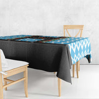 Blue and white patterned Christmas tablecloth with black skirt and draped edge
