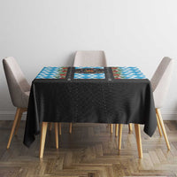 Black Christmas tablecloth with blue geometric center panel and patterned trim
