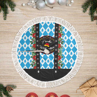 Round Christmas tree skirt with white fringe edge, blue diamond checks, and floral panel