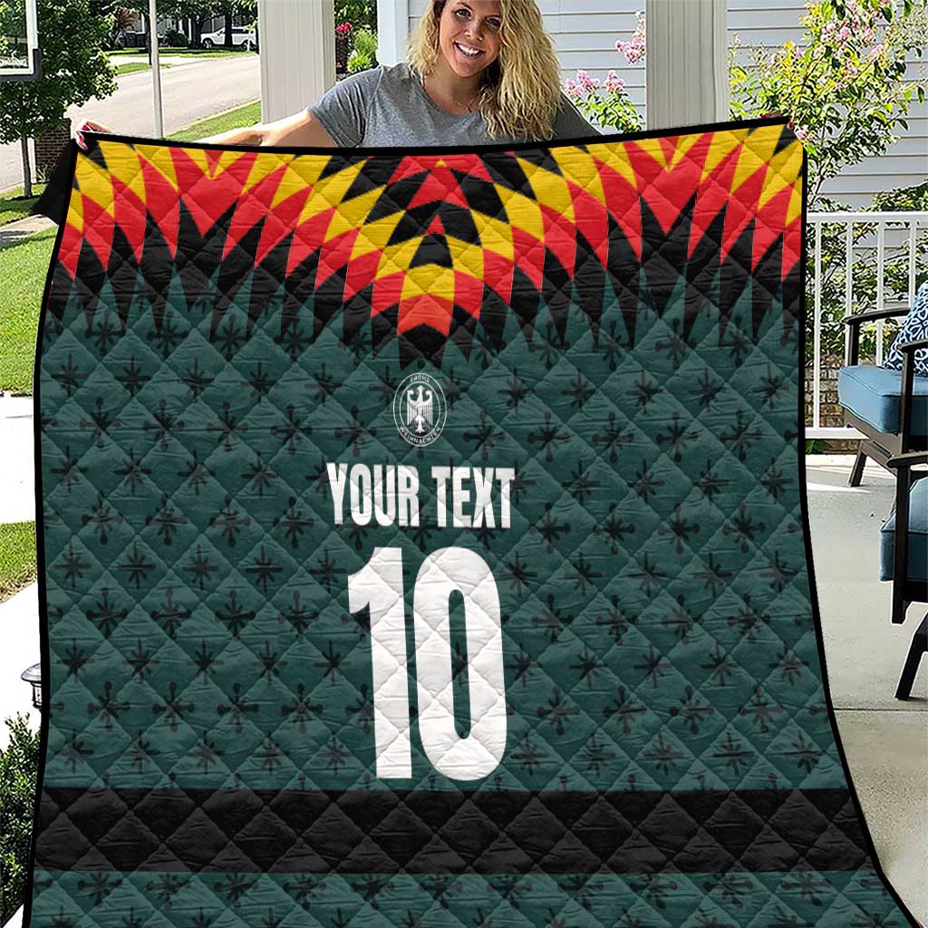 Dark teal quilt blanket with quilted black bottom, star pattern, “YOUR TEXT” and number 10