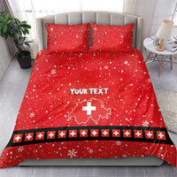Red bedding set with two pillows, snowflakes, Swiss cross map graphic, and custom text