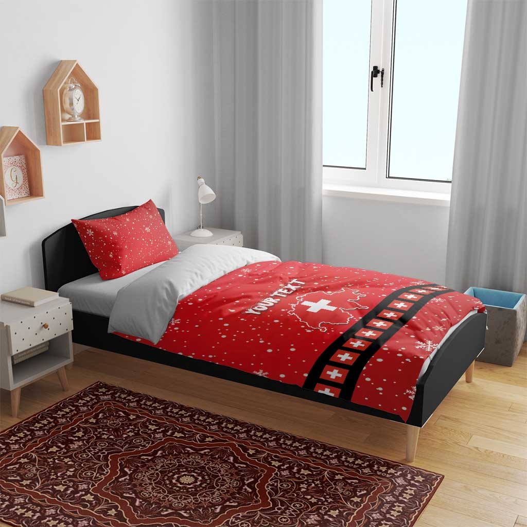 Red duvet cover set with matching pillows, snowflakes, Swiss cross graphic, and 'YOUR TEXT'