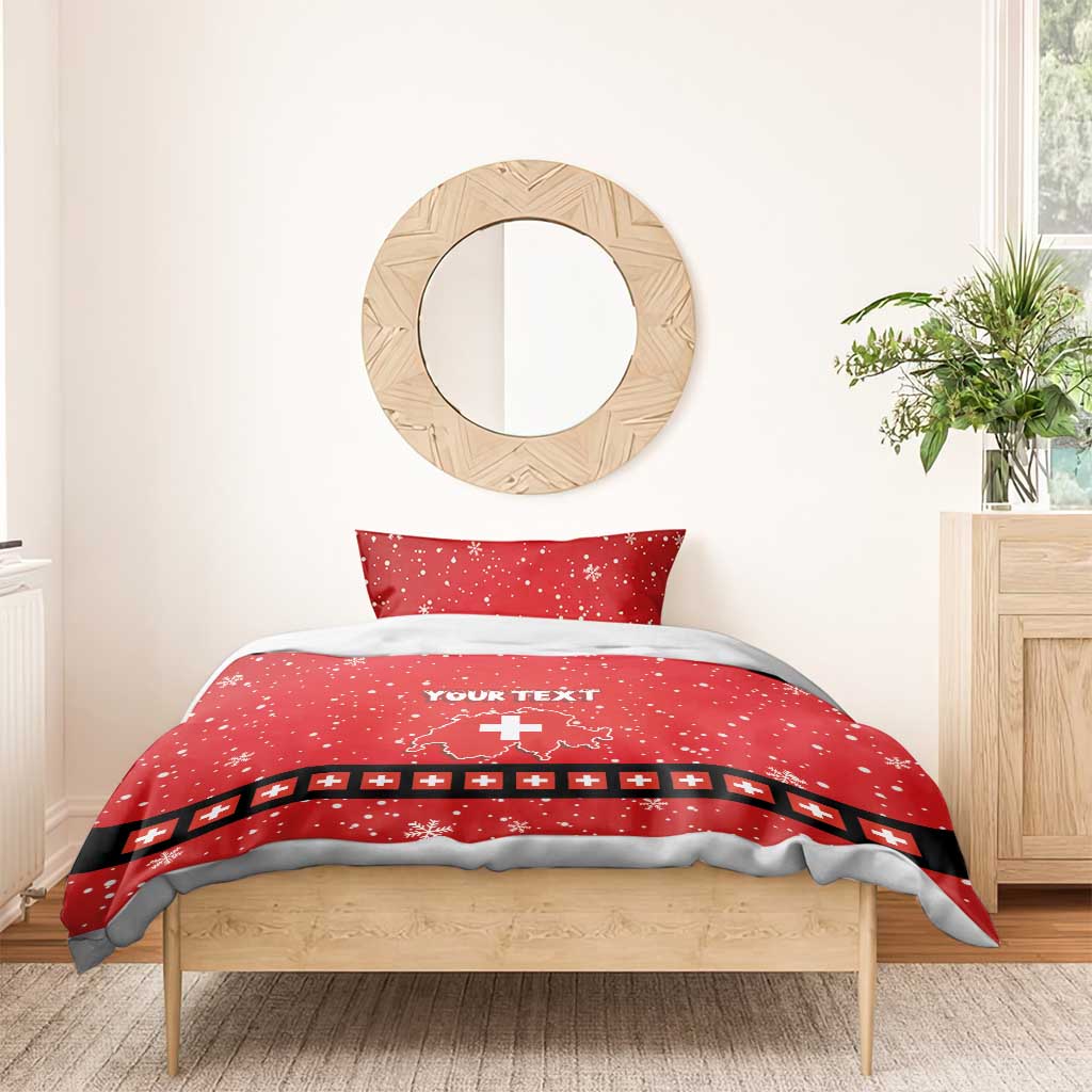 Red duvet cover with 'YOUR TEXT', Swiss cross graphic, black trim, and snowflake pattern