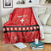 Red holiday throw blanket with Swiss cross, snowflakes, and “Your Text”