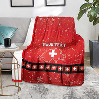 Red personalized throw blanket with Swiss cross, snowflakes, and dark plus stripe