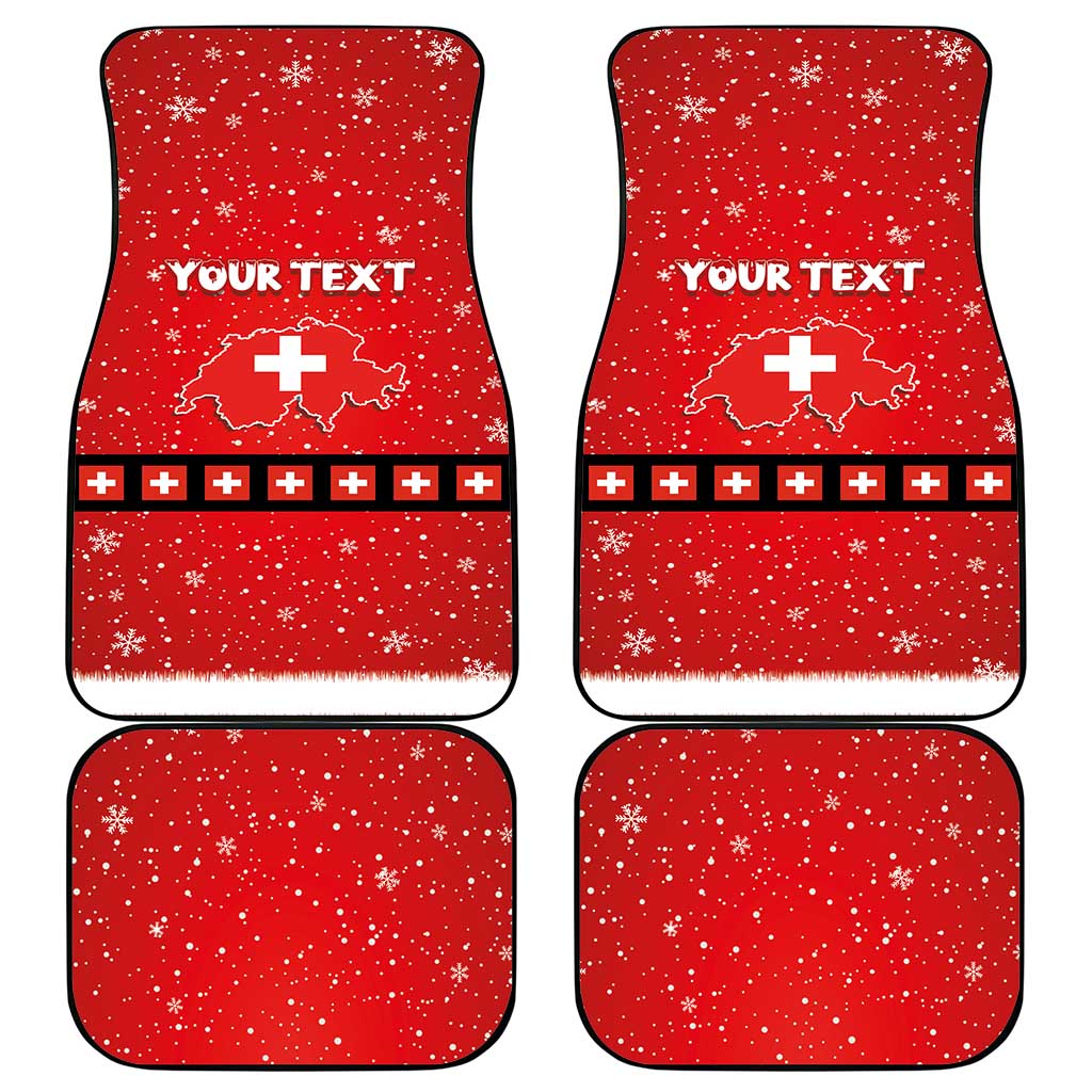 Set of four red car mats with snowflakes, Swiss cross pattern, and 'YOUR TEXT'