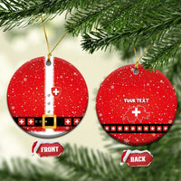 Red round ceramic Swiss-themed Santa suit ornament with gold hanging string