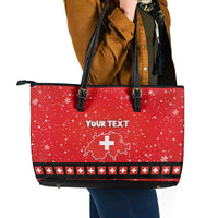 Red patterned leather tote bag with black straps and top zip, "YOUR TEXT"