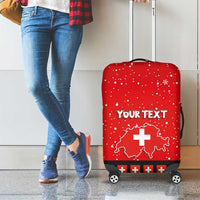 Red luggage cover on wheeled suitcase, Swiss map and cross graphic with 'YOUR TEXT'