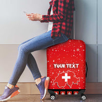 Red luggage cover with Swiss map and cross, 'YOUR TEXT' on front, 4 wheels