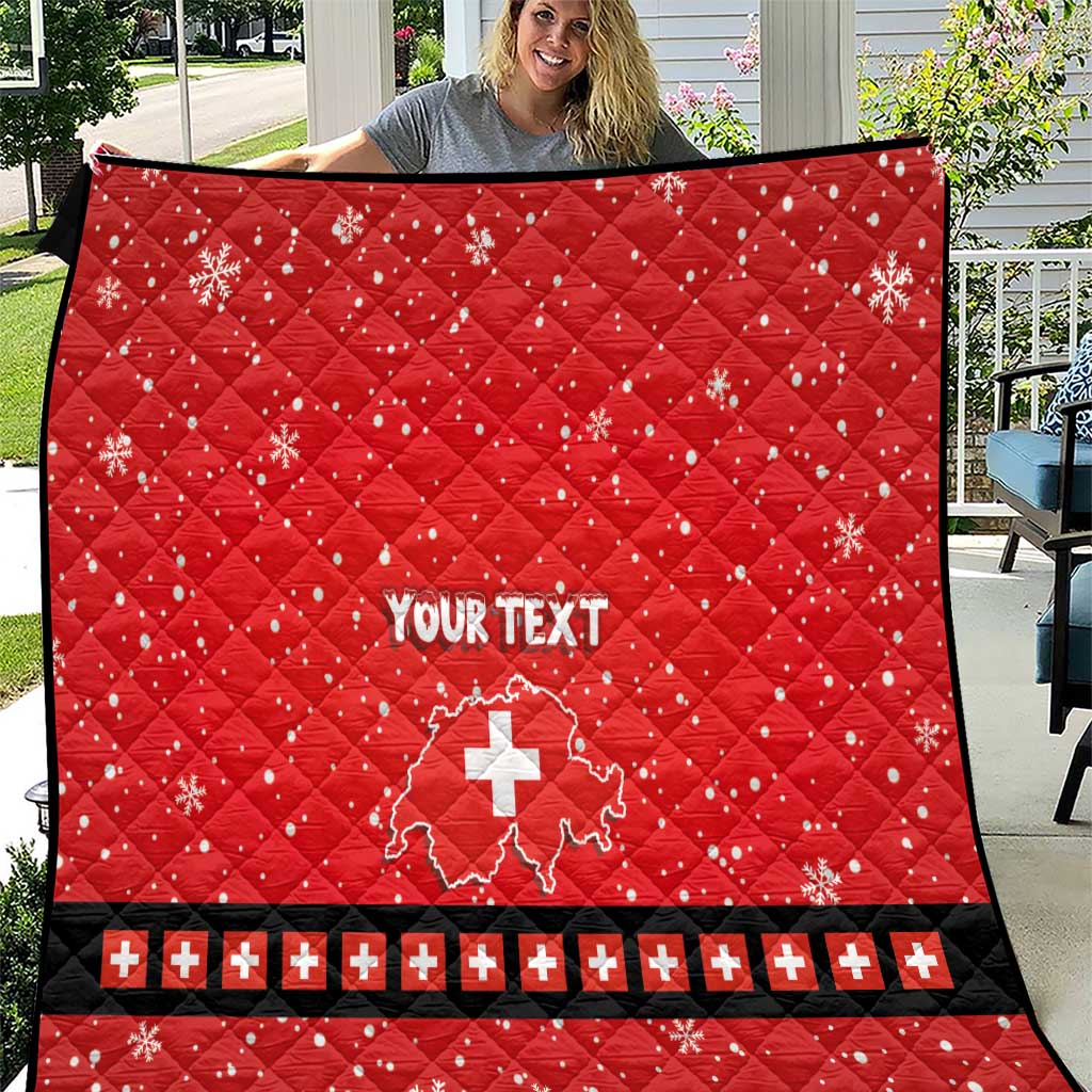 Red personalized quilt with Swiss cross, “YOUR TEXT”, and snowflake pattern