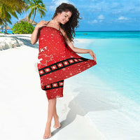 Red Swiss Christmas sarong tied at the waist with snowflakes and cross border detail