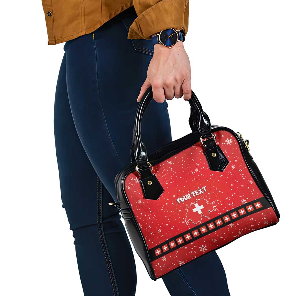 Red patterned handbag with black handles and shoulder strap, “YOUR TEXT” on front.