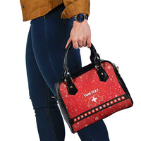 Red patterned handbag with black handles and shoulder strap, “YOUR TEXT” on front.