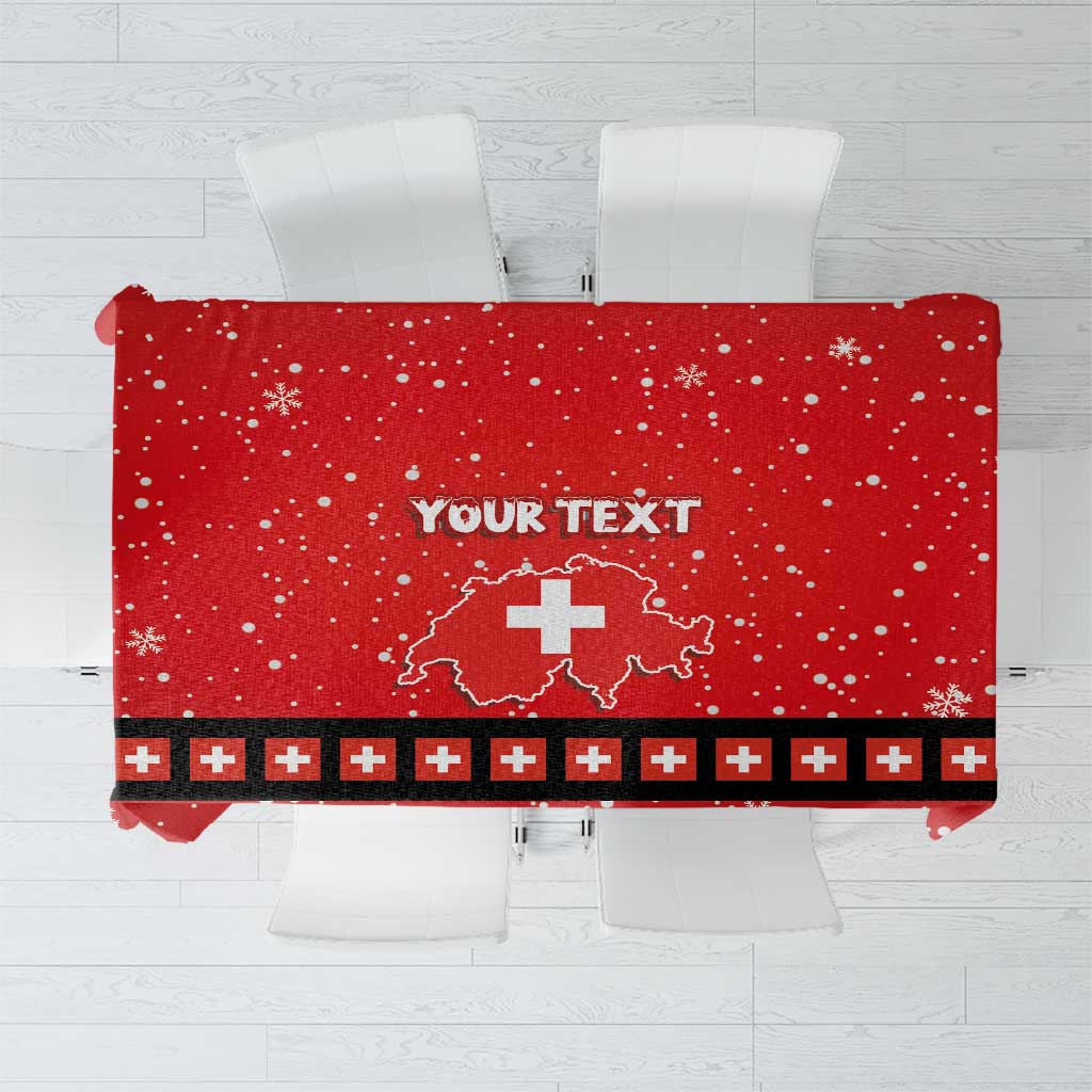 Red tablecloth with snowflake print, “YOUR TEXT” center, Swiss cross emblem stripe