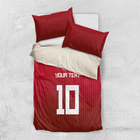 Red Swiss-style duvet set with two pillowcases; cross emblem and large '10' design