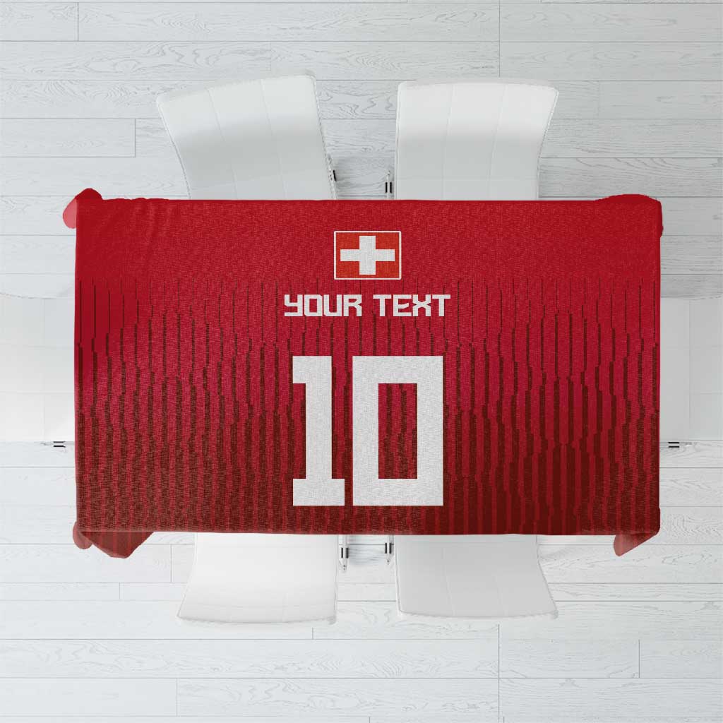 Red tablecloth with Swiss cross, number 10, and custom text design over table