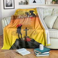 Yellow ANZAC Day blanket with black silhouettes and central cross graphic
