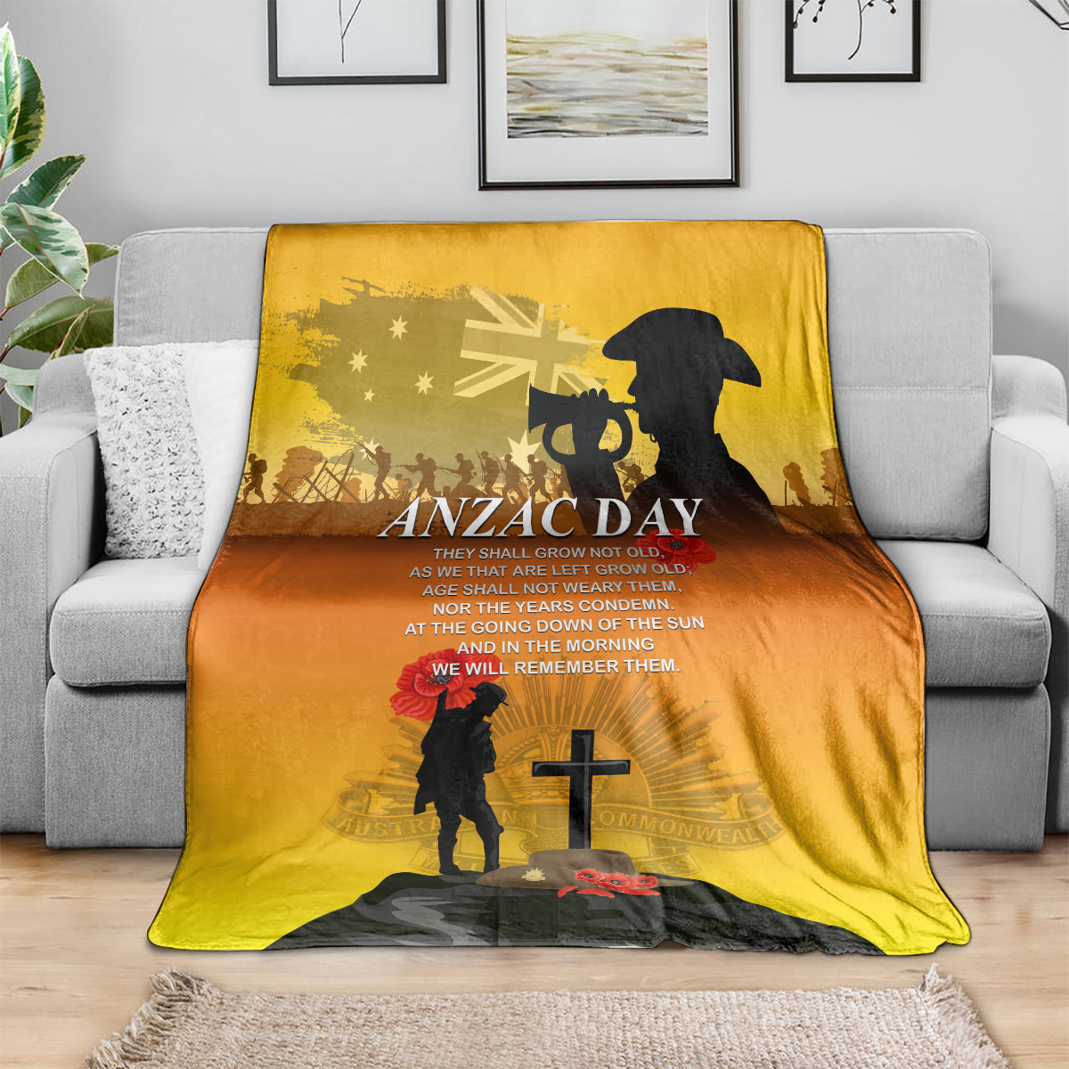 Yellow ANZAC Day throw blanket on couch with soldier, cross and red poppy motif