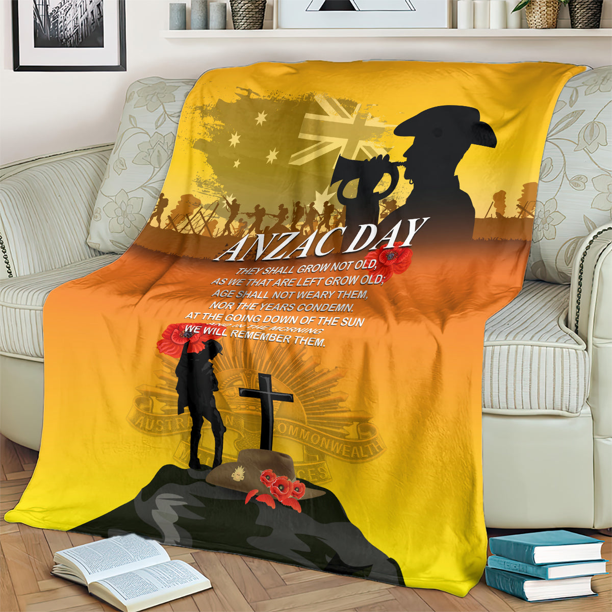 Yellow ANZAC Day blanket draped over sofa, featuring black silhouettes and cross
