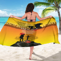 Yellow ANZAC Day sarong draped wide, showing soldier silhouette and poppy emblem
