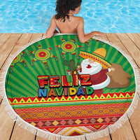 Green round beach blanket with tassel fringe, striped Feliz Navidad design with Santa and cactus