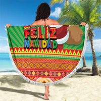 Green round beach blanket with tassel fringe, Feliz Navidad lettering and Santa holding candles