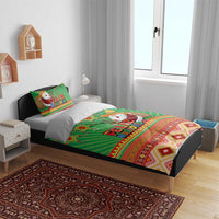 Green Feliz Navidad duvet and pillow set with Santa graphic and geometric border
