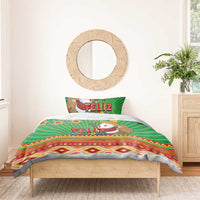 Green Feliz Navidad duvet cover set with Santa print, geometric border, and matching pillows