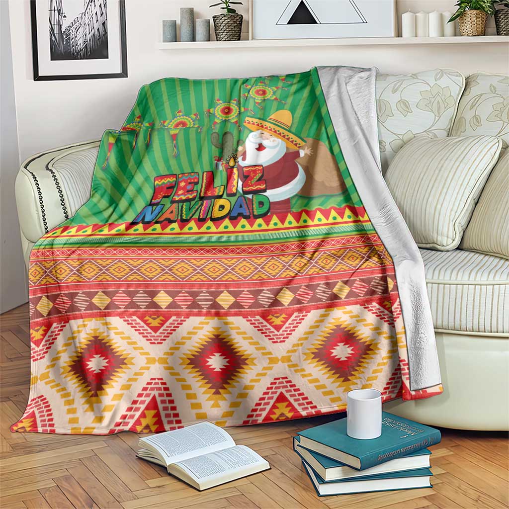 Green Feliz Navidad aztec geometric blanket draped over sofa back