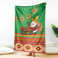 Green Feliz Navidad blanket with cactus and sombrero Santa, spread on floor