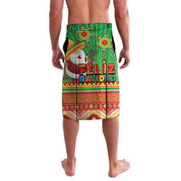 Green Feliz Navidad patterned shorts with Santa and festive text across front