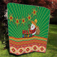 Green Feliz Navidad quilt with aztec geometric stripes and Santa figure center