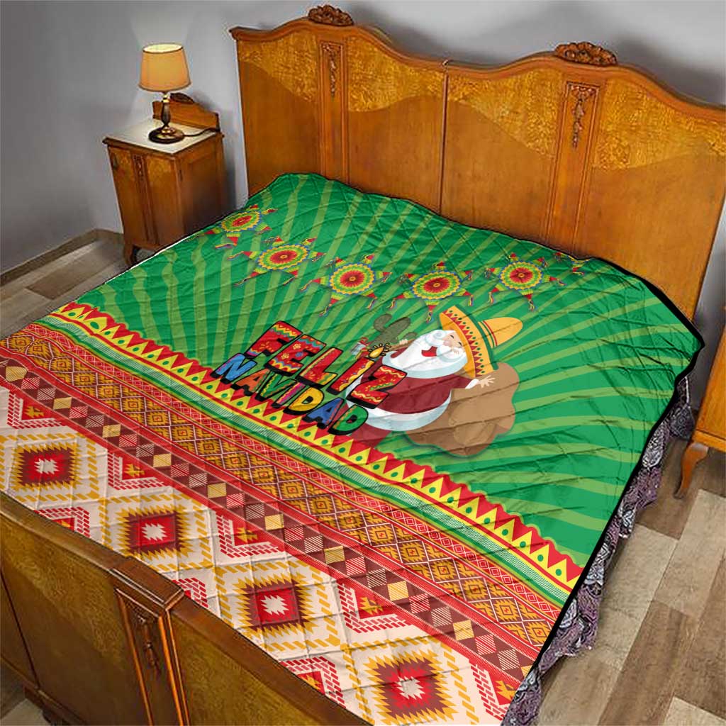 Green Feliz Navidad quilt on bed, featuring aztec border and Santa figure