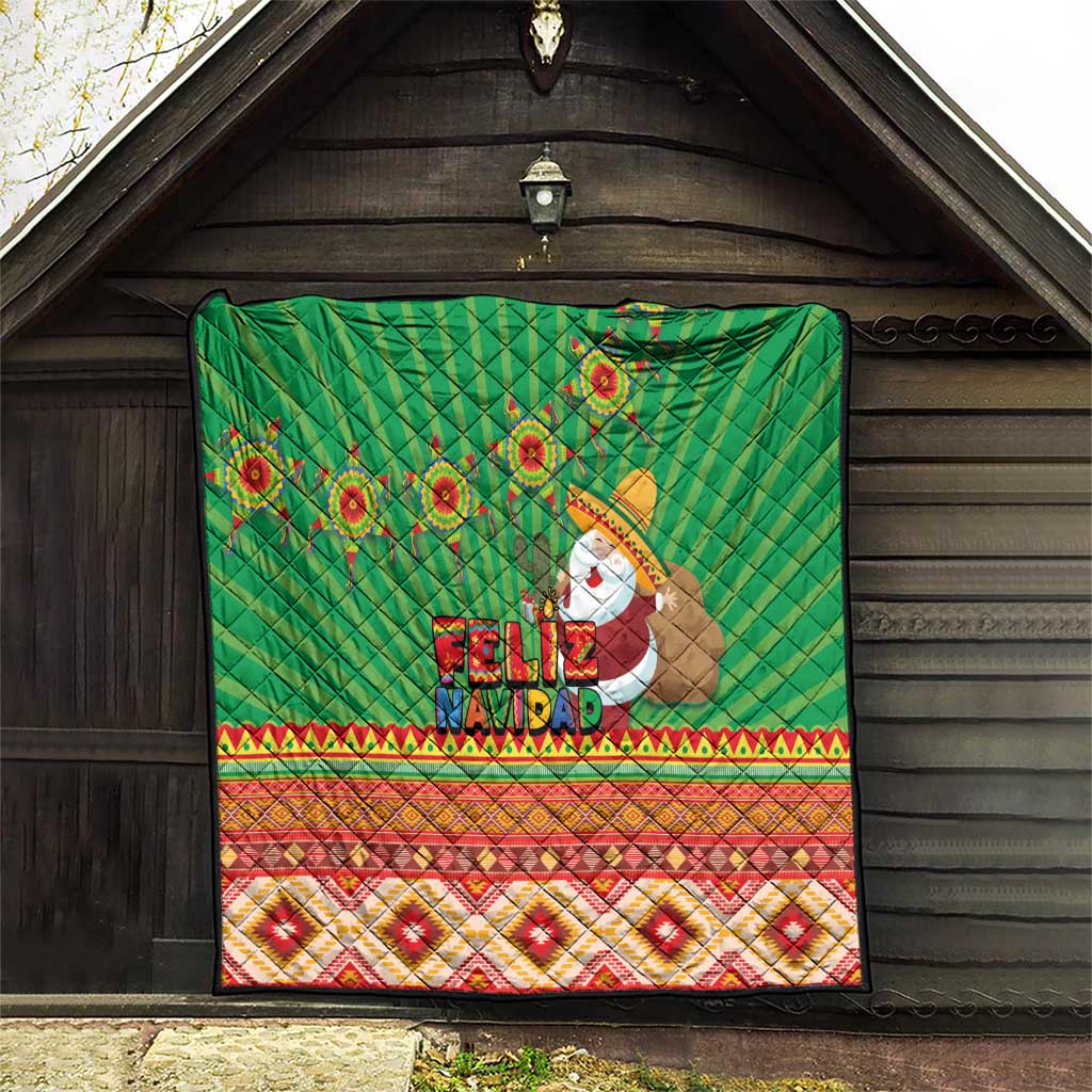 Green Feliz Navidad quilt hung indoors, with aztec geometric stripes and Santa artwork